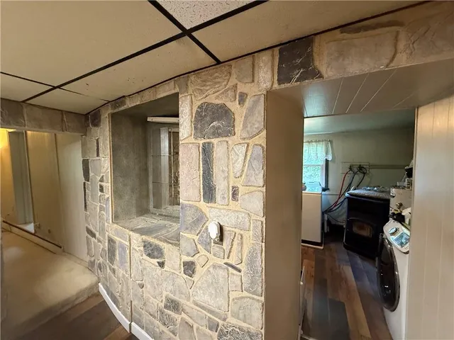 a very nice looking room with a large window and a glass door shower