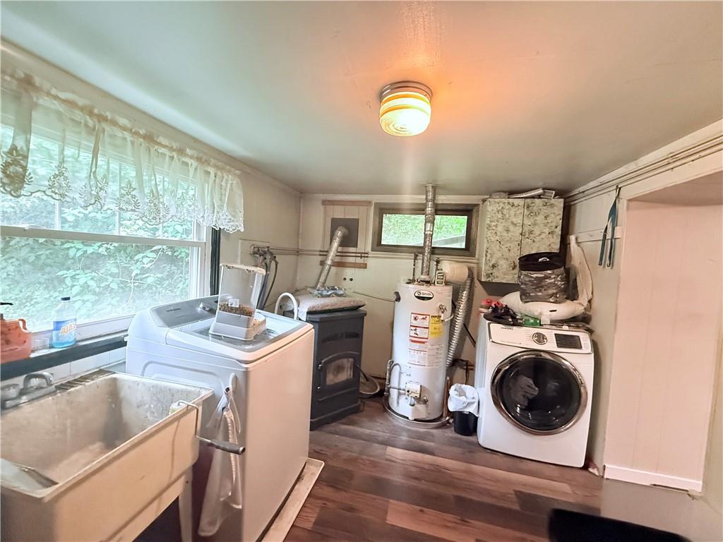337 Coal Valley Road Clairton, PA 15025 - Photo 22 of 30 a view of a kitchen with a sink and dishwasher a stove top oven with wooden floor