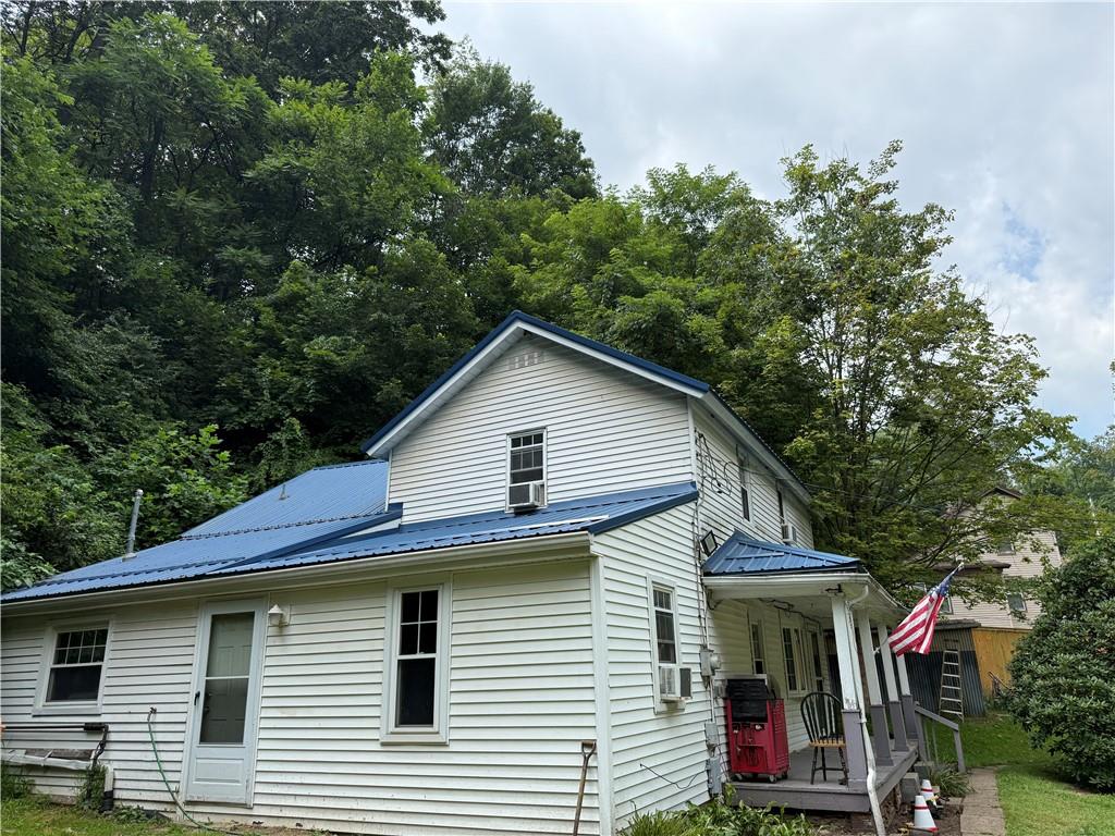 337 Coal Valley Road Clairton, PA 15025 - Photo 3 of 30 a view of a house with a yard and potted plants
