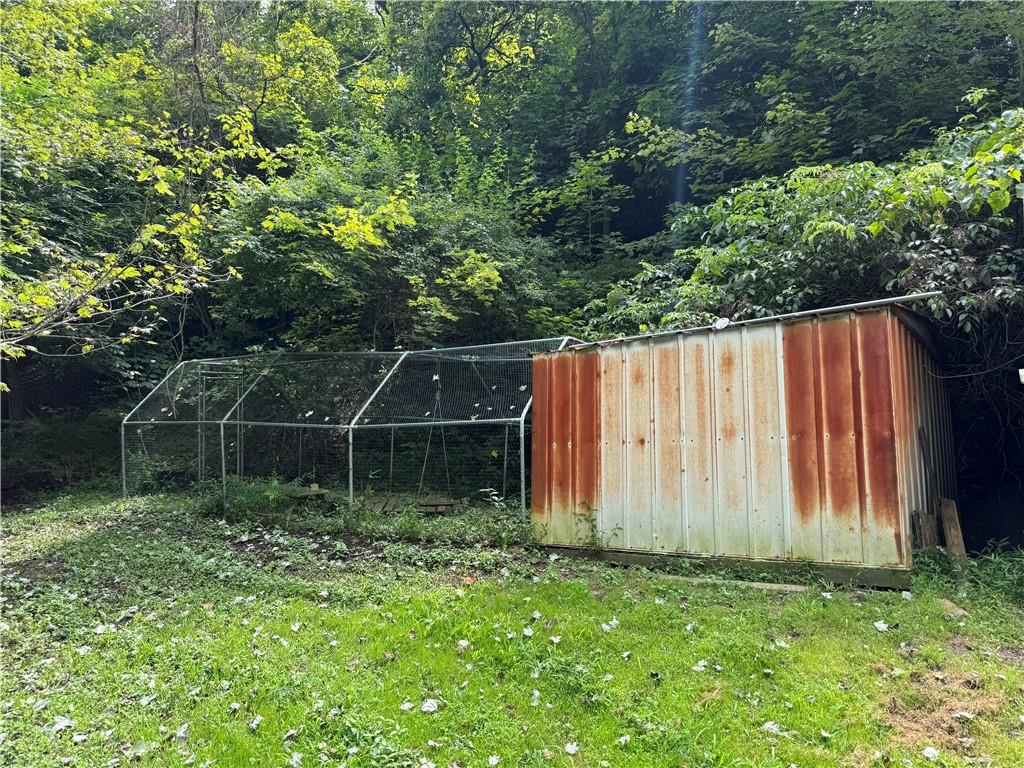 337 Coal Valley Road Clairton, PA 15025 - Photo 7 of 30 a backyard of a house with lots of green space and plants