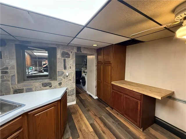 a kitchen with stainless steel appliances granite countertop a sink and cabinets