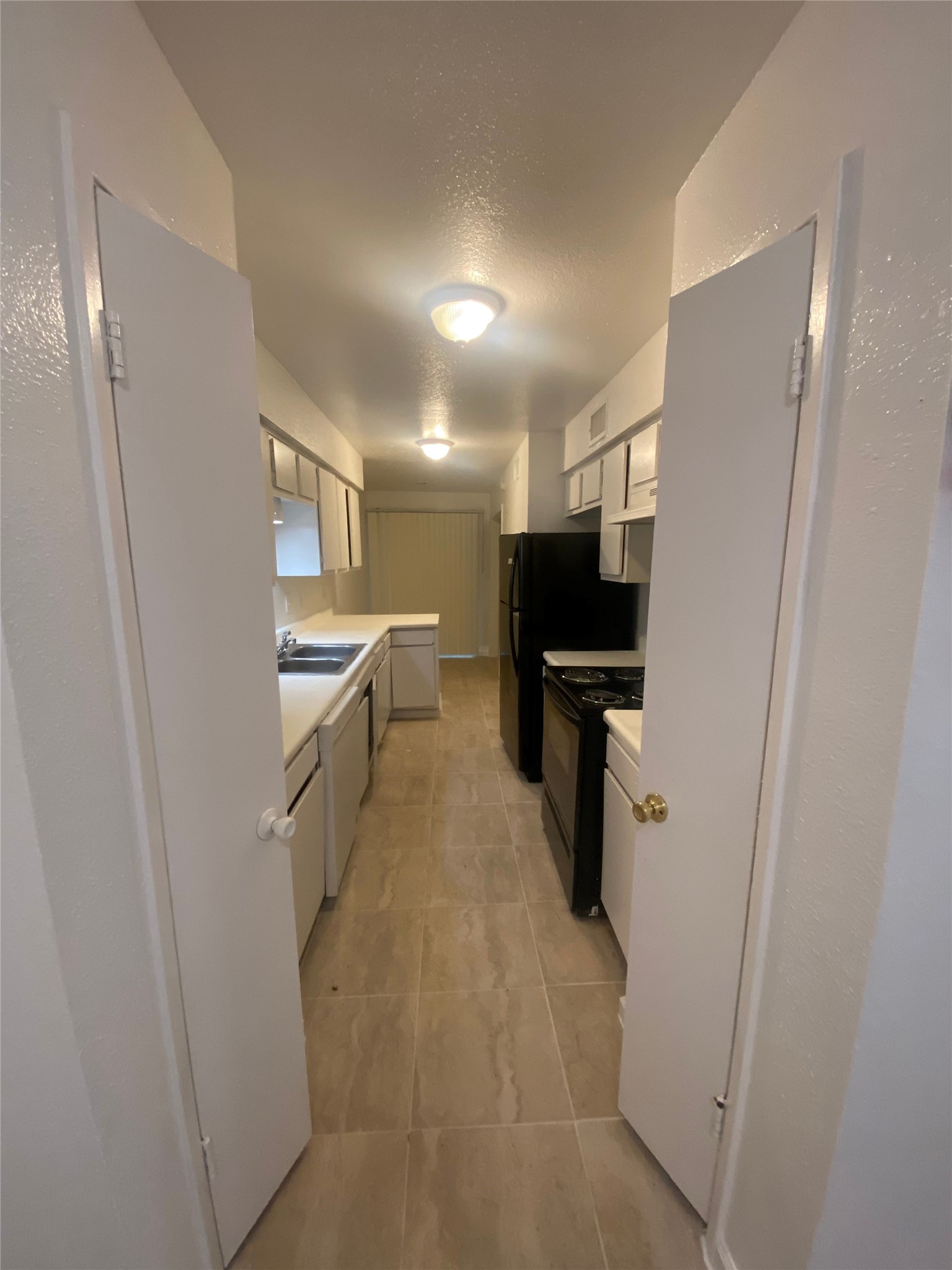 6200 West Tidwell Road, Unit 705 Houston, TX 77092 - Photo 5 of 12 a kitchen with refrigerator and white counter top