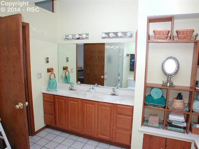 18105 Forest View Road Monument, CO 80132 - Photo 13 of 24 5pc Bath Master Bath with Soaking Tub, Double Sink Vanity, Free-Standing Shower & Shelving!