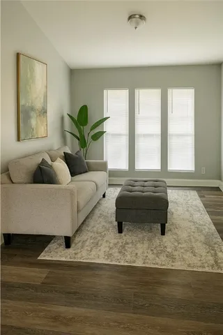 a living room with furniture and a rug