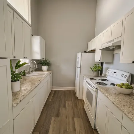 a kitchen with a sink stove and cabinets