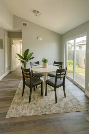 a view of a dining room with furniture