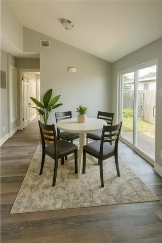 a view of a dining room with furniture