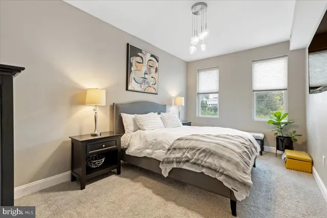 a bedroom with bed and window