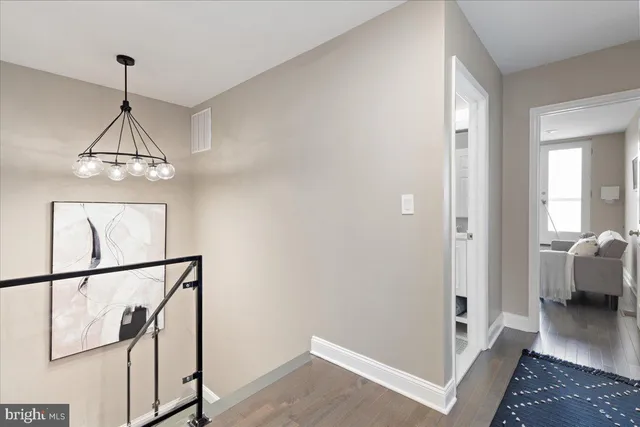 a view of a hallway view with staircase