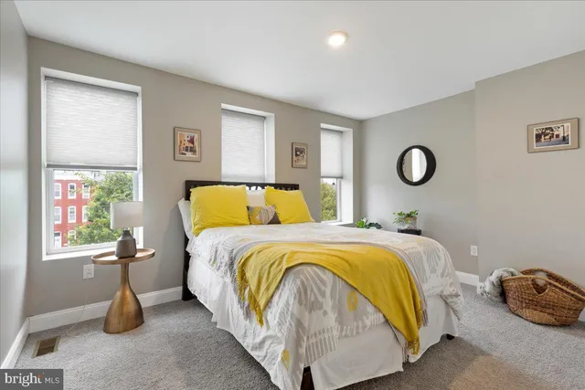 a bedroom with a bed and window