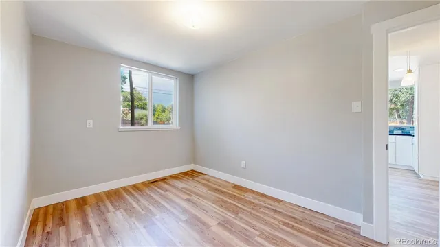 a bathroom with a toilet a sink and a mirror