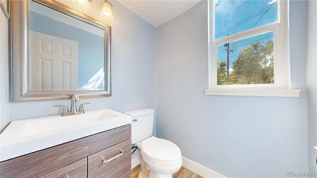 a bathroom with a shower and a mirror