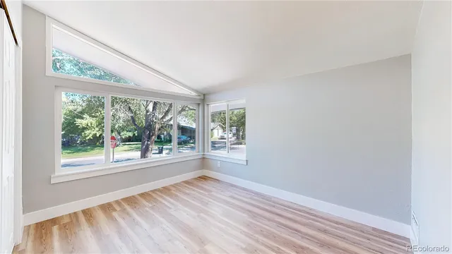 a view of a room with wooden floor and closet