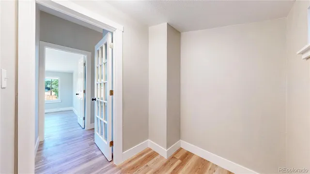 a bathroom with a toilet a sink and a mirror