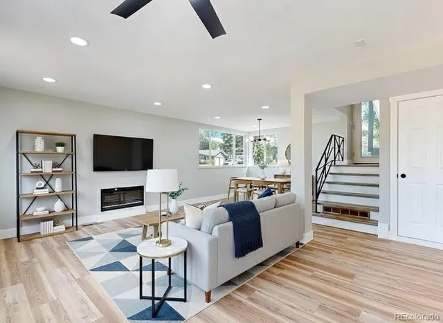 a bedroom with a bed and a wooden floor