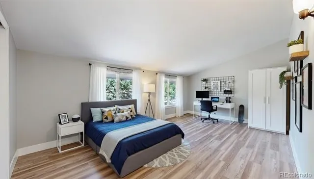 a view of a house with porch and garden