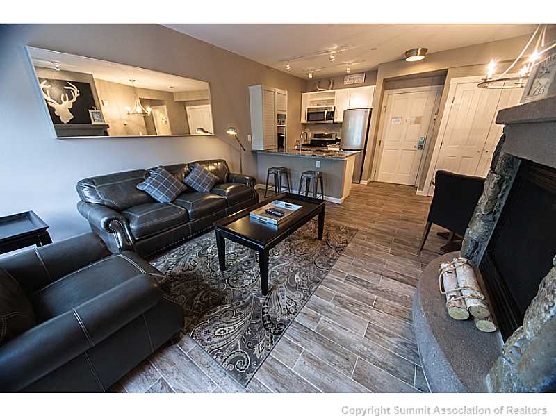 195 River Run Road, Unit 8054 Keystone, CO 80435 - Photo 3 of 24 a living room with furniture and wooden floor