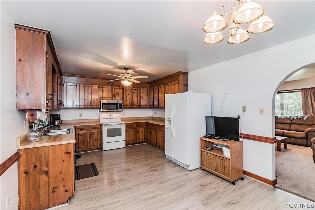 12720 River Road Chesterfield, VA 23838 - Photo 12 of 33 a kitchen with white cabinets and stainless steel appliances
