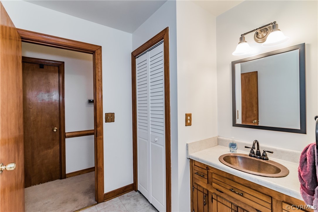 12720 River Road Chesterfield, VA 23838 - Photo 18 of 33 a bathroom with a sink and a mirror