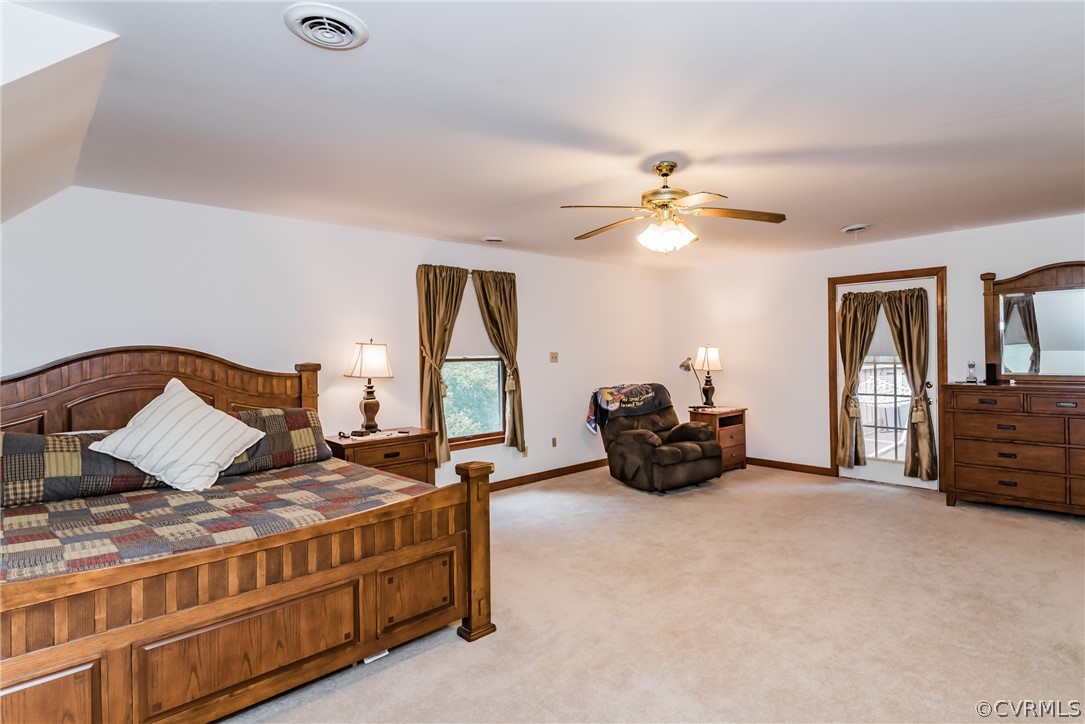12720 River Road Chesterfield, VA 23838 - Photo 21 of 33 a bed room with furniture and a chandelier