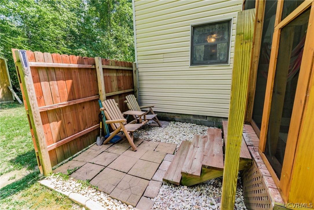 12720 River Road Chesterfield, VA 23838 - Photo 33 of 33 a backyard of a house with table and chairs
