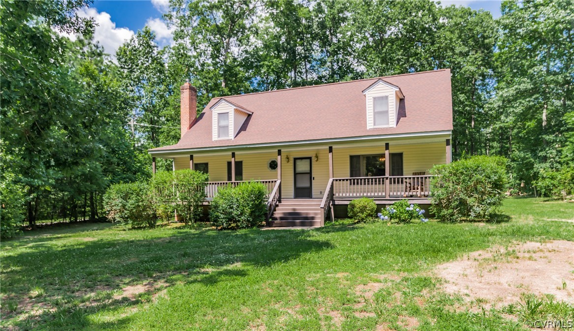 12720 River Road Chesterfield, VA 23838 - Photo 4 of 33 a front view of a house with garden