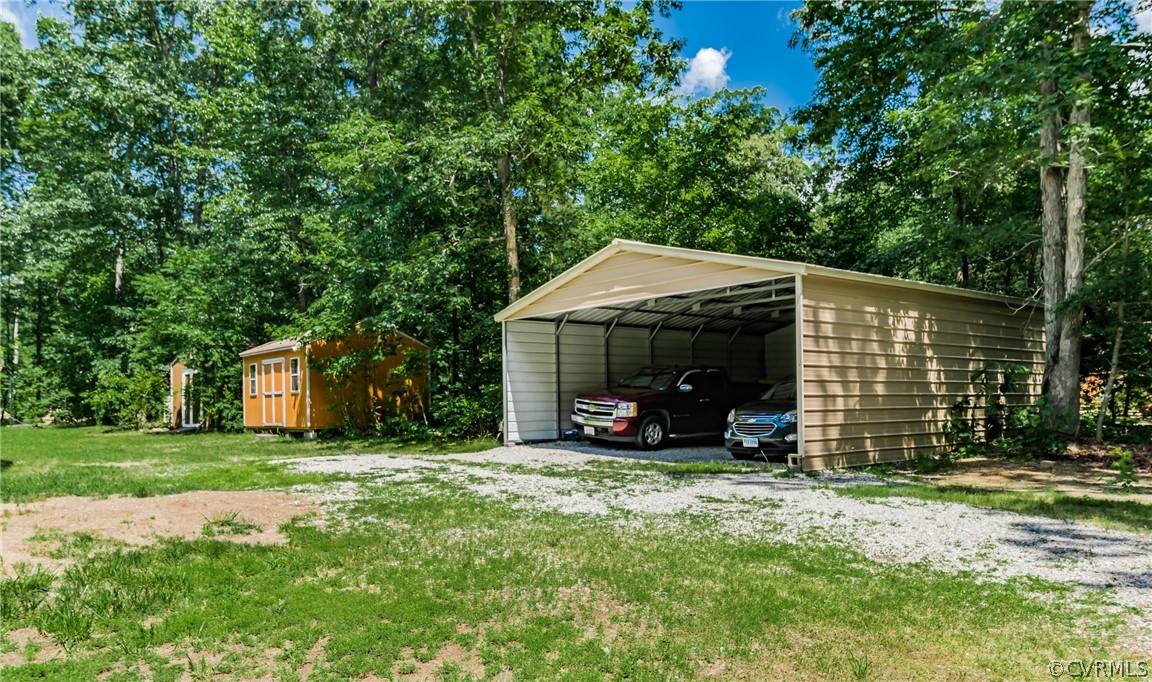 12720 River Road Chesterfield, VA 23838 - Photo 6 of 33 a view of a house with backyard and trees
