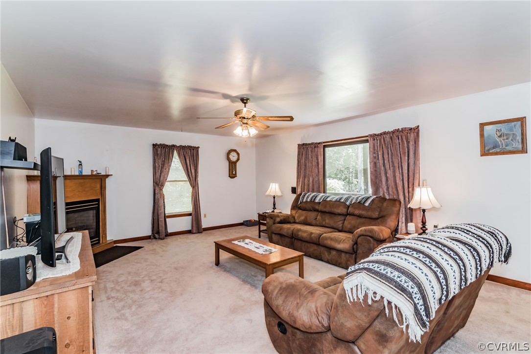 12720 River Road Chesterfield, VA 23838 - Photo 9 of 33 a living room with furniture ceiling fan and a flat screen tv