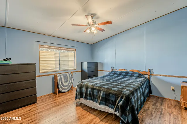 a bedroom with a bed and a dresser