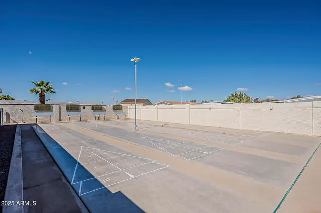a large kitchen with stainless steel appliances lots of counter space and a sink