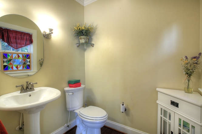 1454 Rugby Road Charlottesville, VA 22903 - Photo 11 of 33 a bathroom with a sink mirror and toilet