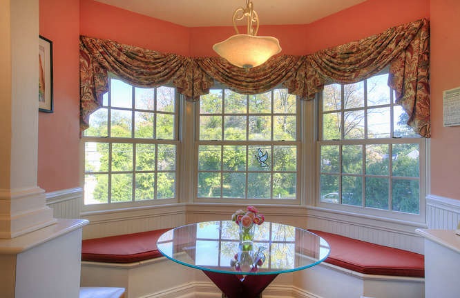 1454 Rugby Road Charlottesville, VA 22903 - Photo 12 of 33 a view of a dining room with furniture a chandelier and a large window