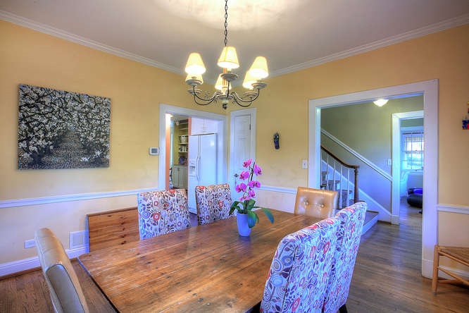 1454 Rugby Road Charlottesville, VA 22903 - Photo 13 of 33 a view of a dining room with furniture and wooden floor