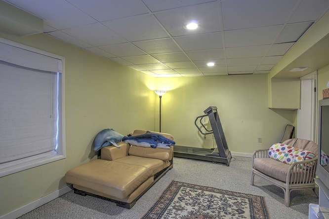 1454 Rugby Road Charlottesville, VA 22903 - Photo 22 of 33 a bedroom with a bed and gym equipment