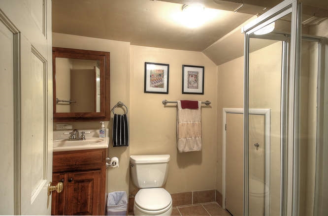 1454 Rugby Road Charlottesville, VA 22903 - Photo 23 of 33 a bathroom with a toilet and a shower