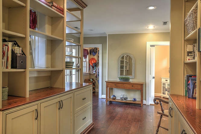 1454 Rugby Road Charlottesville, VA 22903 - Photo 6 of 33 a hallway with cabinets and wooden floor