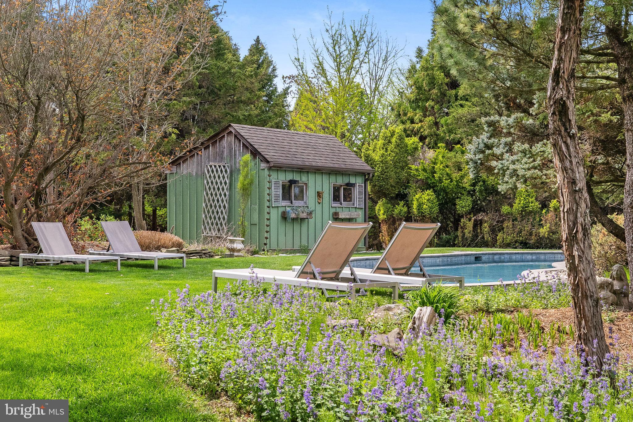 65 Covered Bridge Road New Hope, PA 18938 - Photo 103 of 117 a view of a house with a backyard patio and swimming pool