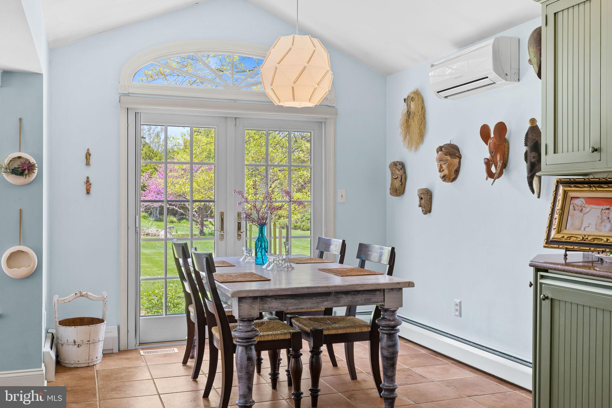 65 Covered Bridge Road New Hope, PA 18938 - Photo 41 of 117 a view of a dining room with furniture a chandelier and a window