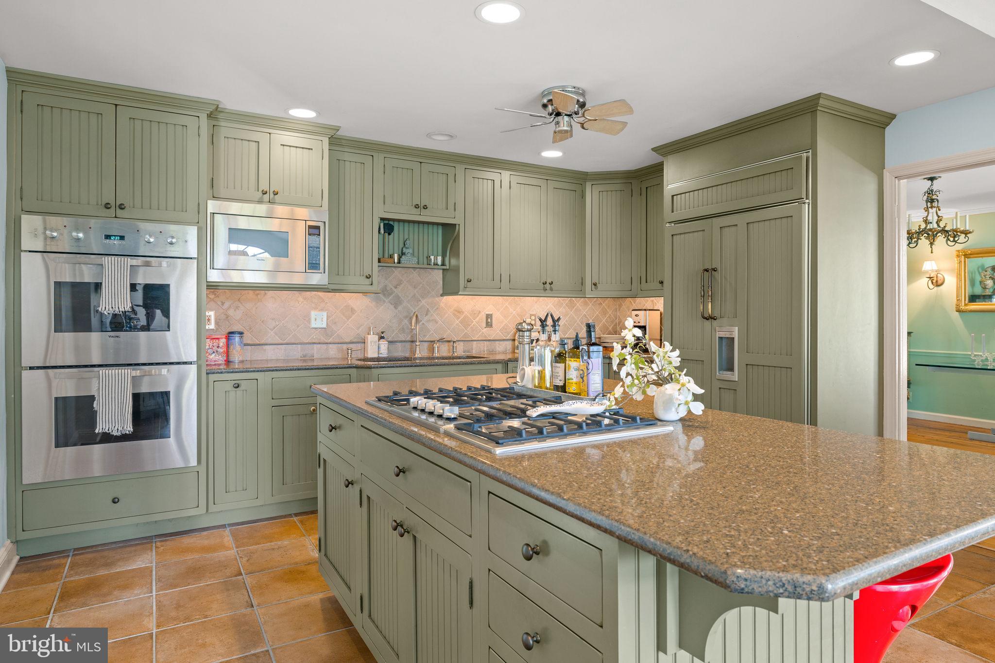 65 Covered Bridge Road New Hope, PA 18938 - Photo 44 of 117 a kitchen with stainless steel appliances granite countertop a stove and a sink