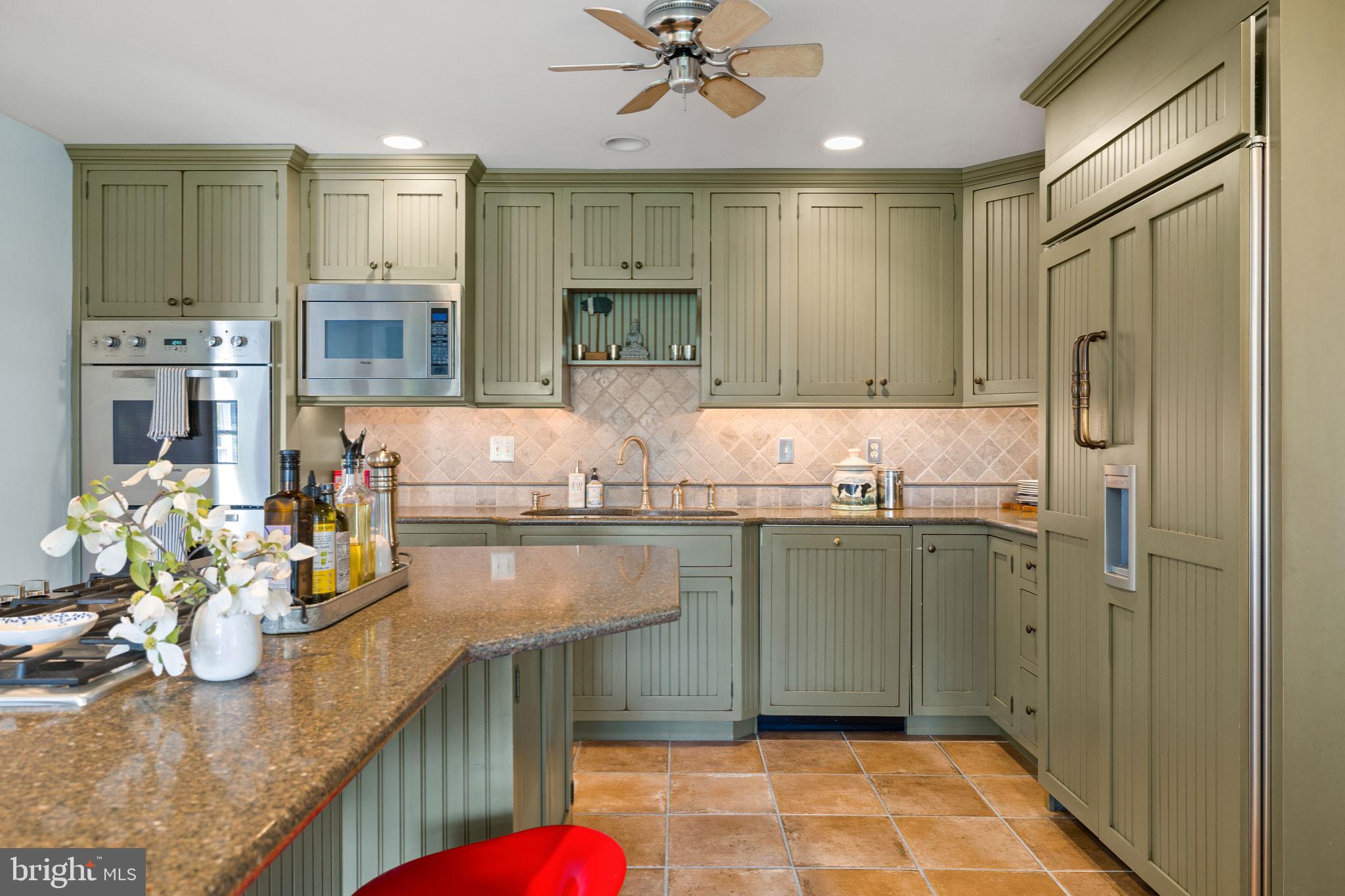 65 Covered Bridge Road New Hope, PA 18938 - Photo 45 of 117 a kitchen with stainless steel appliances granite countertop a sink and a refrigerator