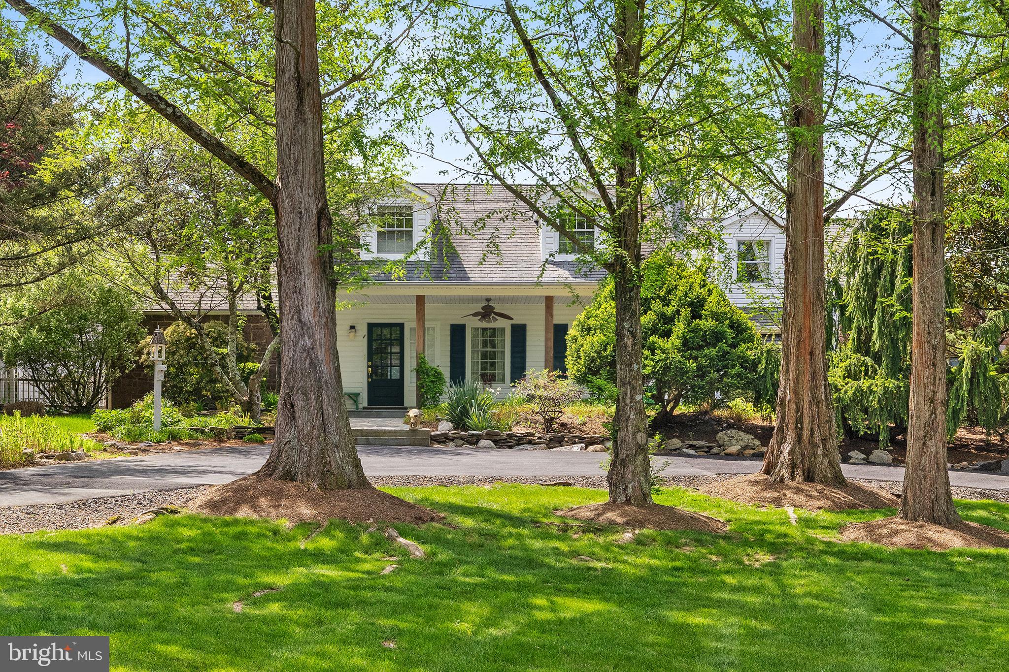 65 Covered Bridge Road New Hope, PA 18938 - Photo 5 of 117 a front view of a house with garden and trees
