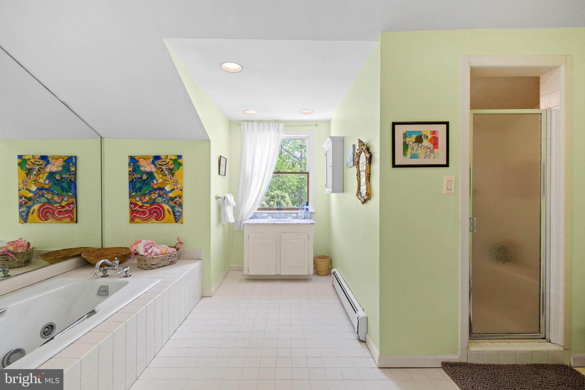 65 Covered Bridge Road New Hope, PA 18938 - Photo 63 of 117 a bathroom with a tub sink and mirror