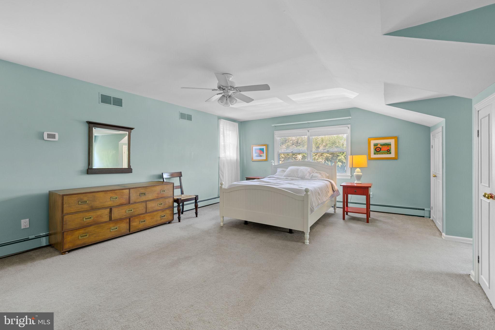 65 Covered Bridge Road New Hope, PA 18938 - Photo 66 of 117 a spacious bedroom with a bed and a table