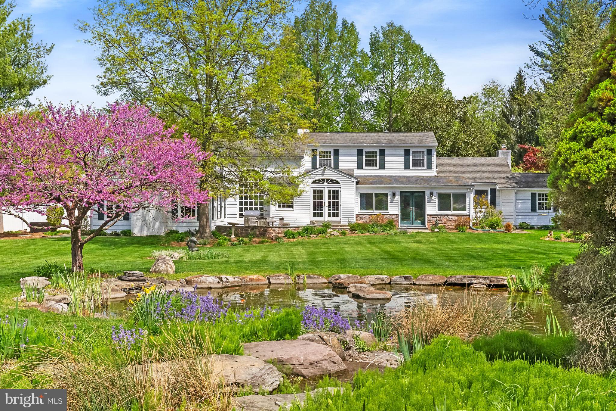 65 Covered Bridge Road New Hope, PA 18938 - Photo 74 of 117 a front view of a house with a yard table and chairs