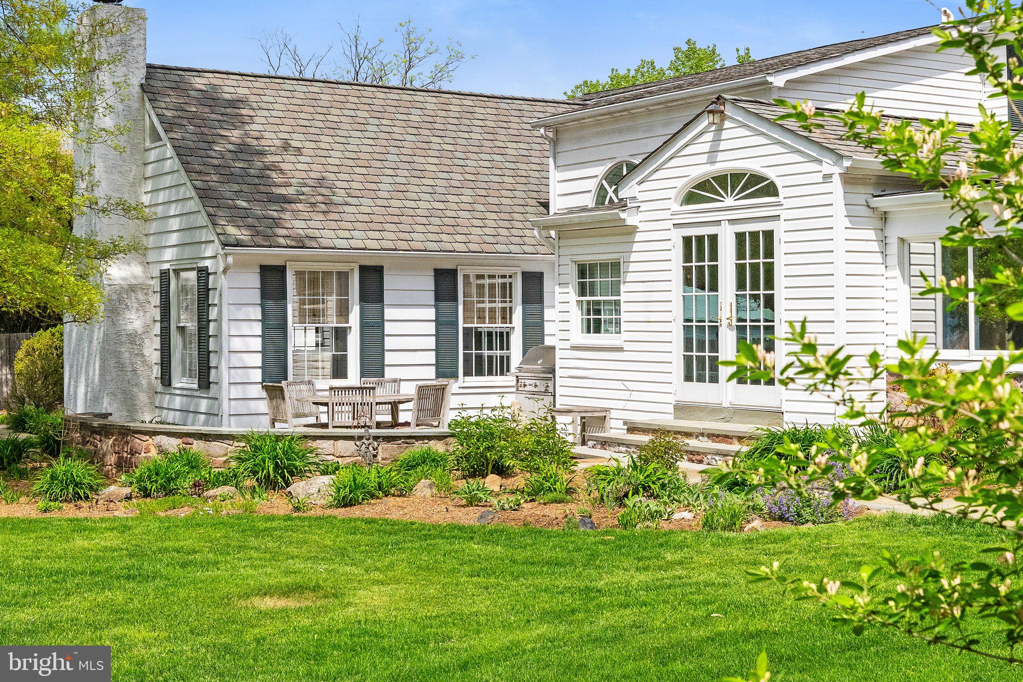 65 Covered Bridge Road New Hope, PA 18938 - Photo 81 of 117 a front view of a house with a yard and potted plants