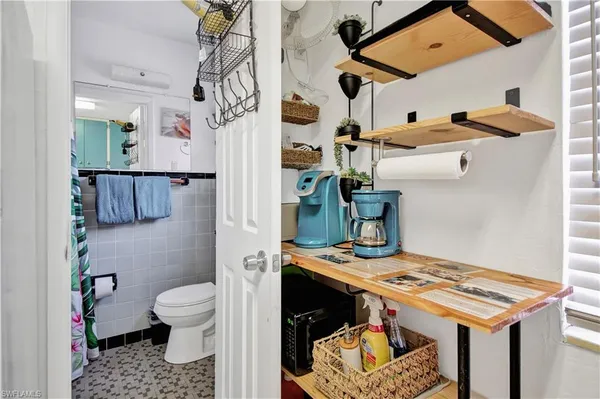 a bathroom with a sink a toilet and a shower
