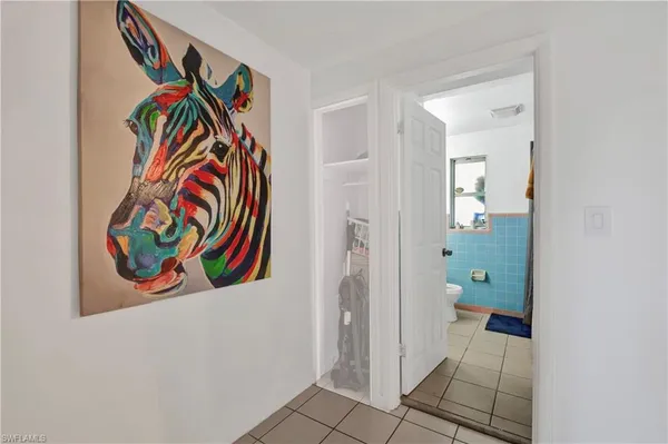a view of an entryway and wooden floor