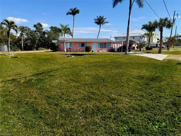 a view of a big yard next to a house
