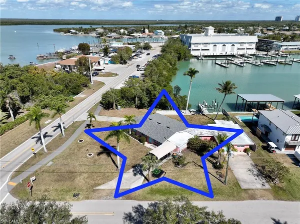 an aerial view of a house with a ocean view