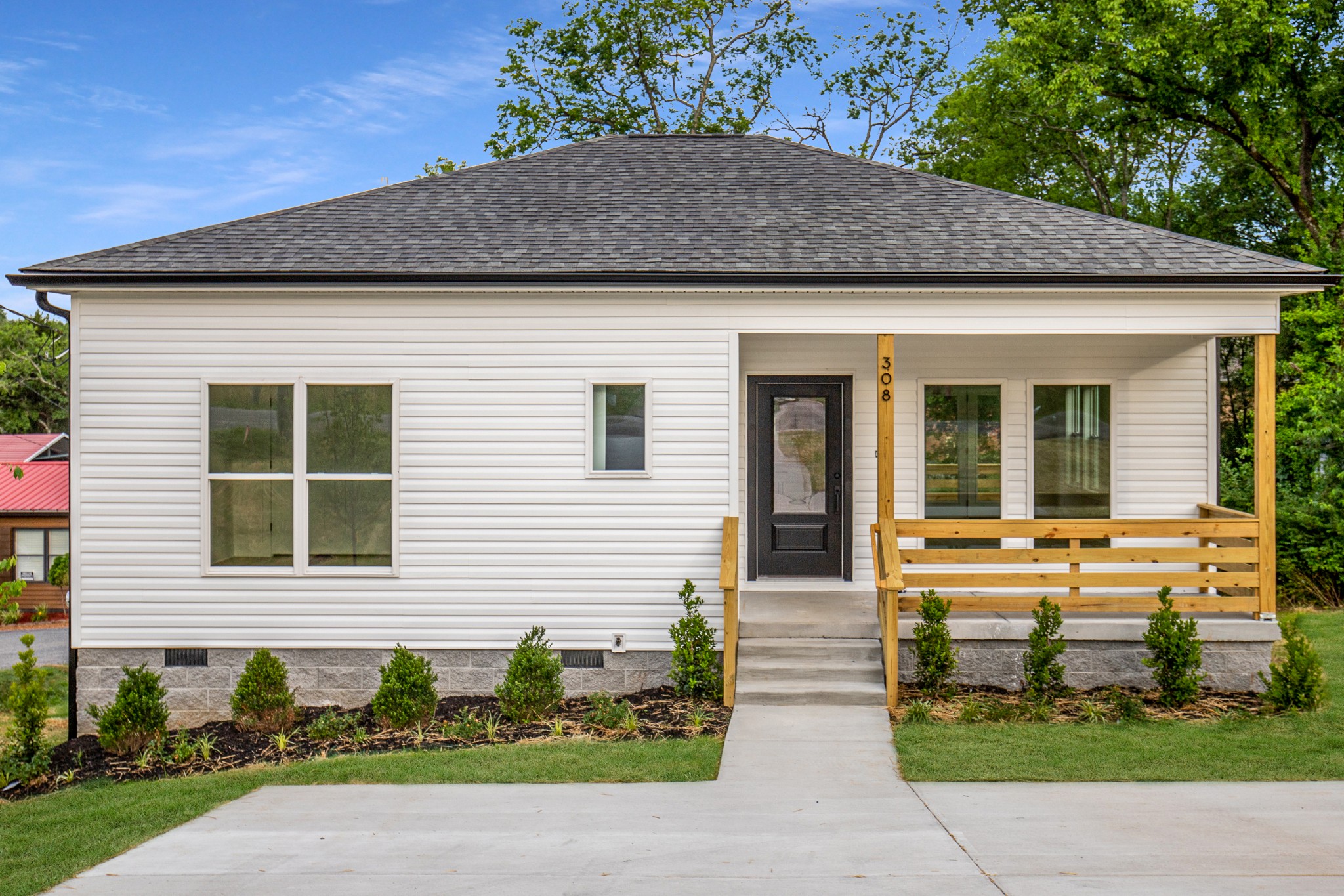 308 Larkin Springs Road Madison, TN 37115 - Photo 2 of 25 a front view of a house with garden